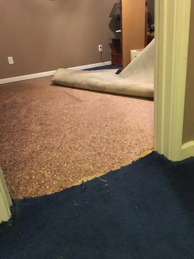 Carpet pad removal revealing water damage during Water Mitigation Services in Vallejo